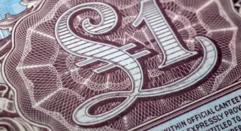 Détail d'un billet de banque avec une grande inscription 1 livre sterling.