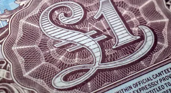 Zbliżenie na brytyjski banknot wojskowy o nominale jednego funta