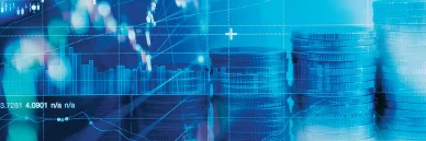 Piles de pièces et graphiques financiers représentant les résultats des Études et données économiques.