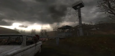 Un poste de contrôle abandonné sous un ciel orageux dans l'un des premiers jeux STALKER.