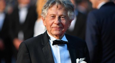 Portrait de Roman Polanski en smoking lors d’un festival international.