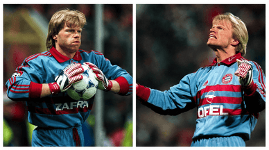 Oliver Kahn im Trikot des FC Bayern München mit Ball in den Händen und im Torwartsprung