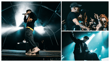 LON3R JOHNY a cantar ao microfone em palco com luzes e público