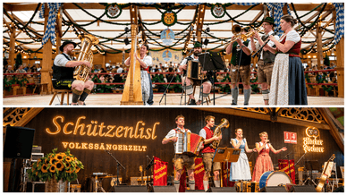 Trachtenmusikanten mit Tuba, Harfe und Akkordeon im Festzelt