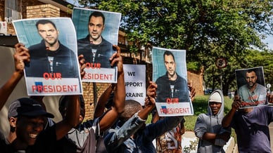 Група прихильників Олексія з плакатами в Преторії, Південна Африка