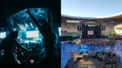 Ambiente previo al concierto Público alzando las manos y escenario iluminado en un estadio