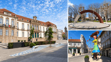 Praça, arco escultórico metálico e boneca gigante numa rua