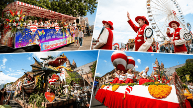 Geschmückter Festwagen, Fischer in traditionellen roten Kostümen und ein Drachenwagen beim Umzug des Wormser Backfischfestes
