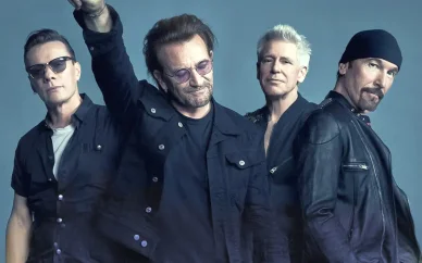 All four members of U2 band — Bono, The Edge, Adam Clayton, and Larry Mullen Jr. standing