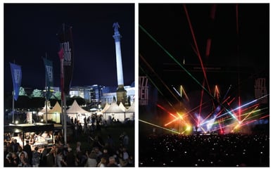 Das Festivalgelände mit Jazz-Open-Fahnen, weißen Zelten und der Jubiläums-Säule vor dem Hintergrund des nächtlichen Stuttgart sowie die Lasershow auf der Bühne mit bunten Strahlen über Tausenden von Zuschauern mit Handys