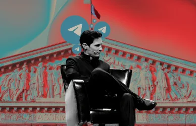 Pavel Dourov sur scène lors d’un événement, fond orné du logo Telegram et de l’Assemblée nationale.