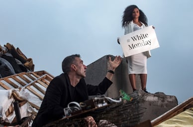 Black Friday reaches out his hand to the future, Circular Monday, in a rubbish tip.