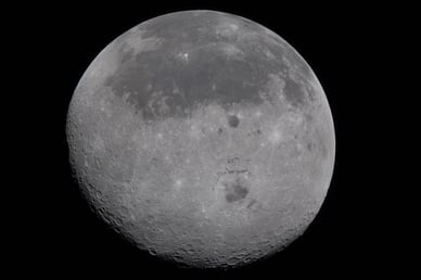 In this view of the Moon, the near side (the hemisphere we see from Earth), is visible at the top half of the Moon disk