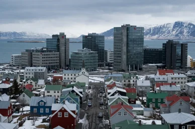Reykjavík’s houses, over which large, modern bank office buildings tower disproportionately