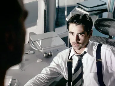 A frame from the science fiction film Minority Report showing a futuristic interface with characters interacting in a high‑tech, near‑future setting.