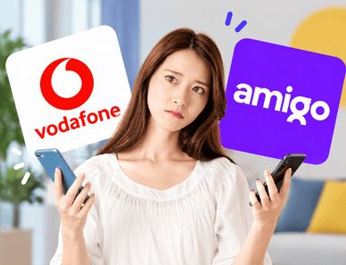 Mulher a segurar telemóveis com logótipos Vodafone e Amigo