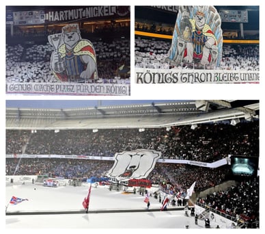 Fans der Eisbären Berlin mit Fahnen und Transparenten auf den Tribünen der Uber Arena während eines Spiels